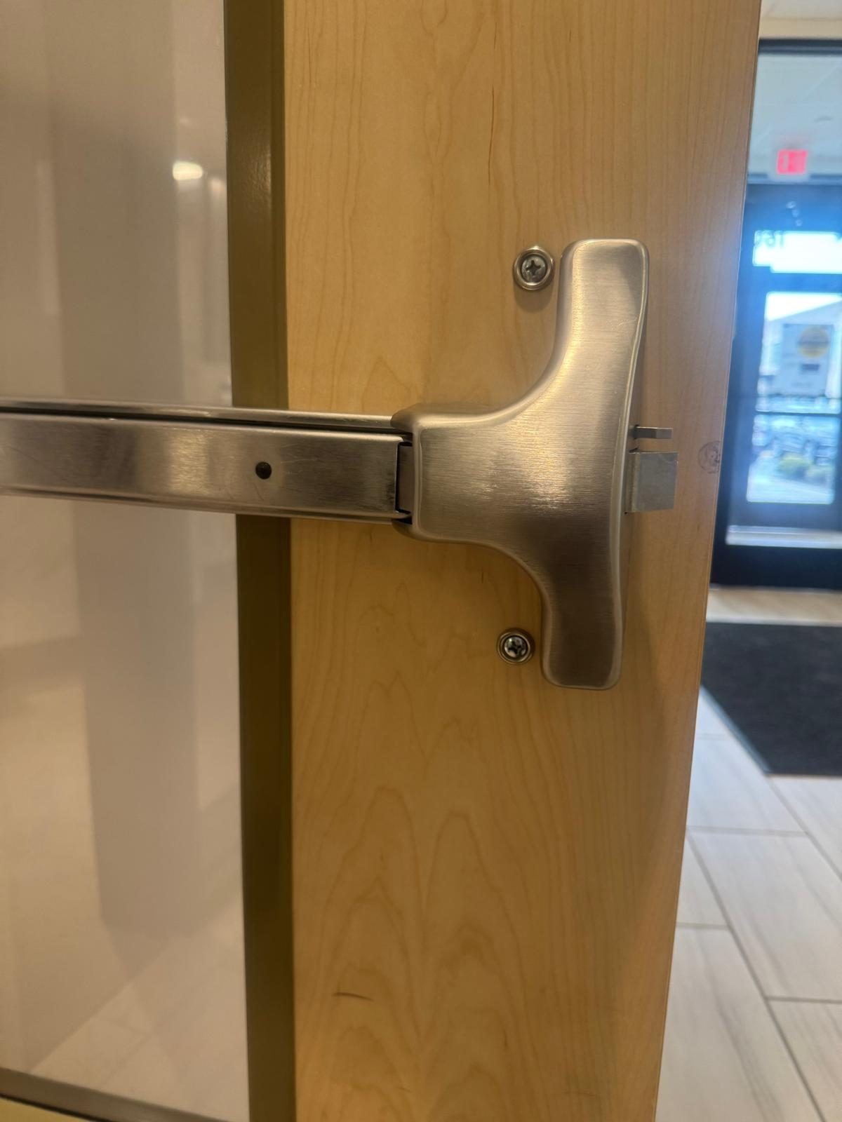 Panic bar hardware installed on an office door